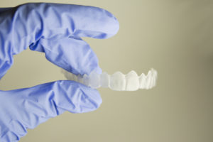 Contact Your Periodontist To Straighten Crooked Teeth With Invisalign